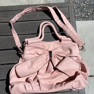 Cute Pink purse with bow at the front